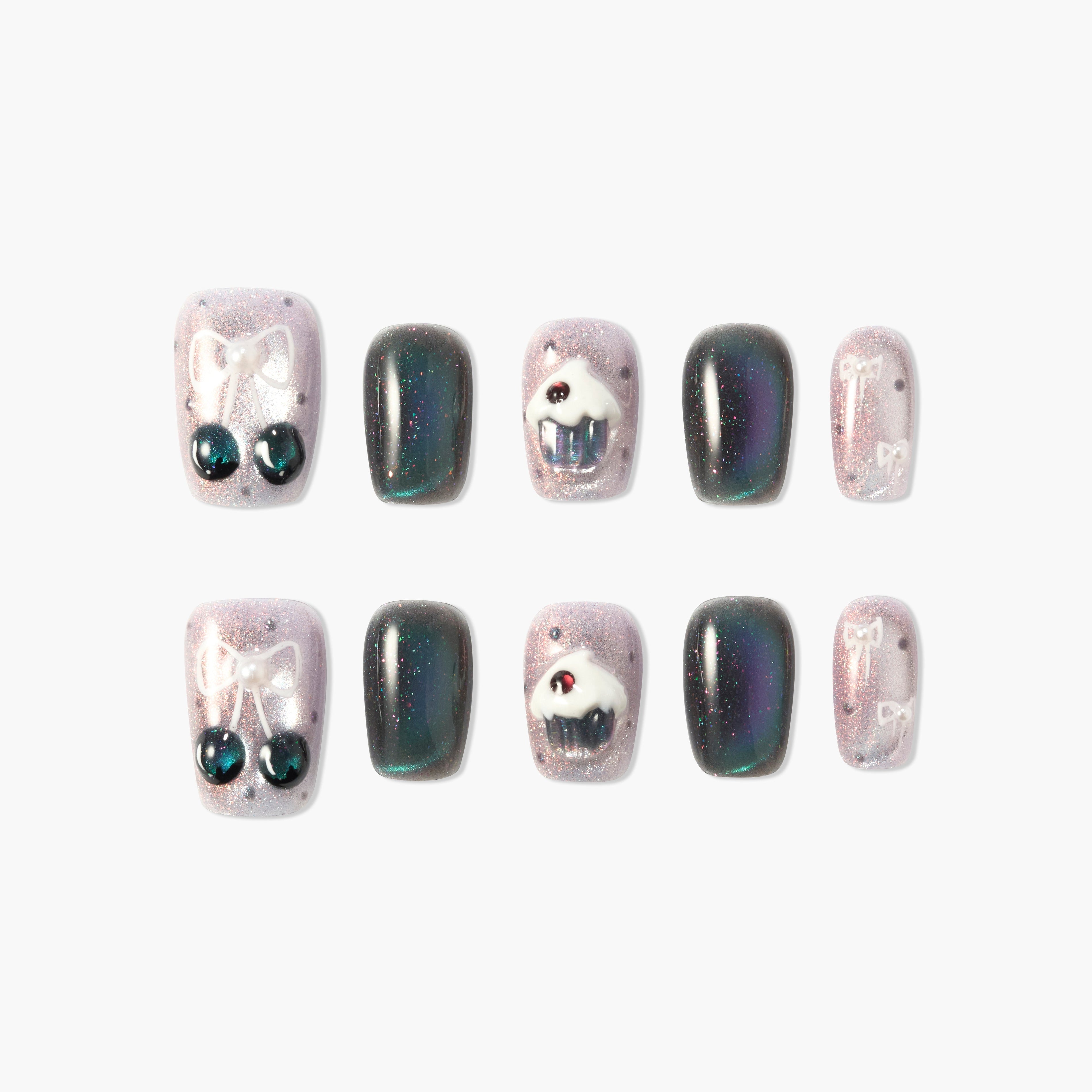 Set of glittery press-on nails with cherry and cupcake 3D designs and dark holographic accents