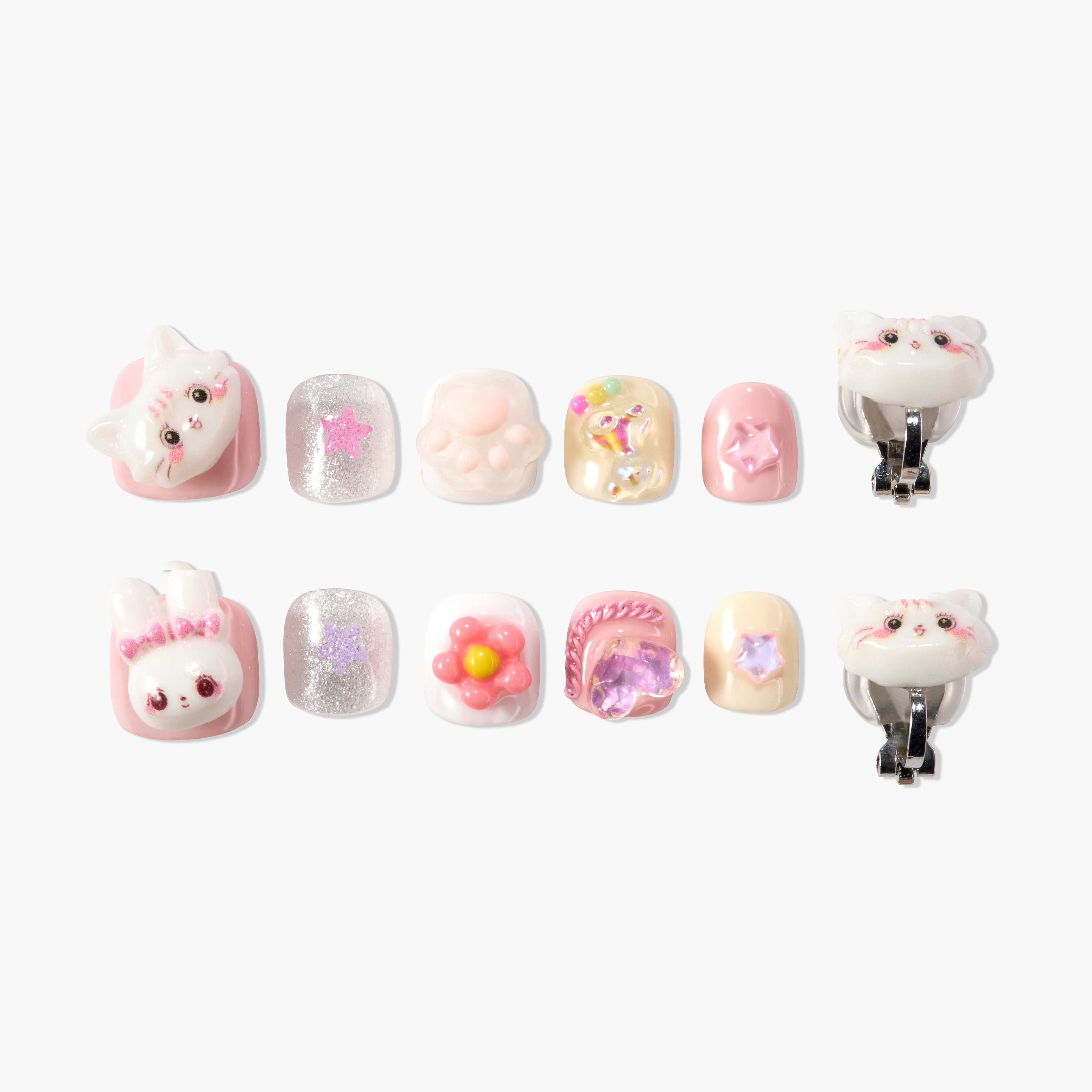 Set of colorful 3D press-on nails with cat, bunny, paw, star, and flower designs on white background