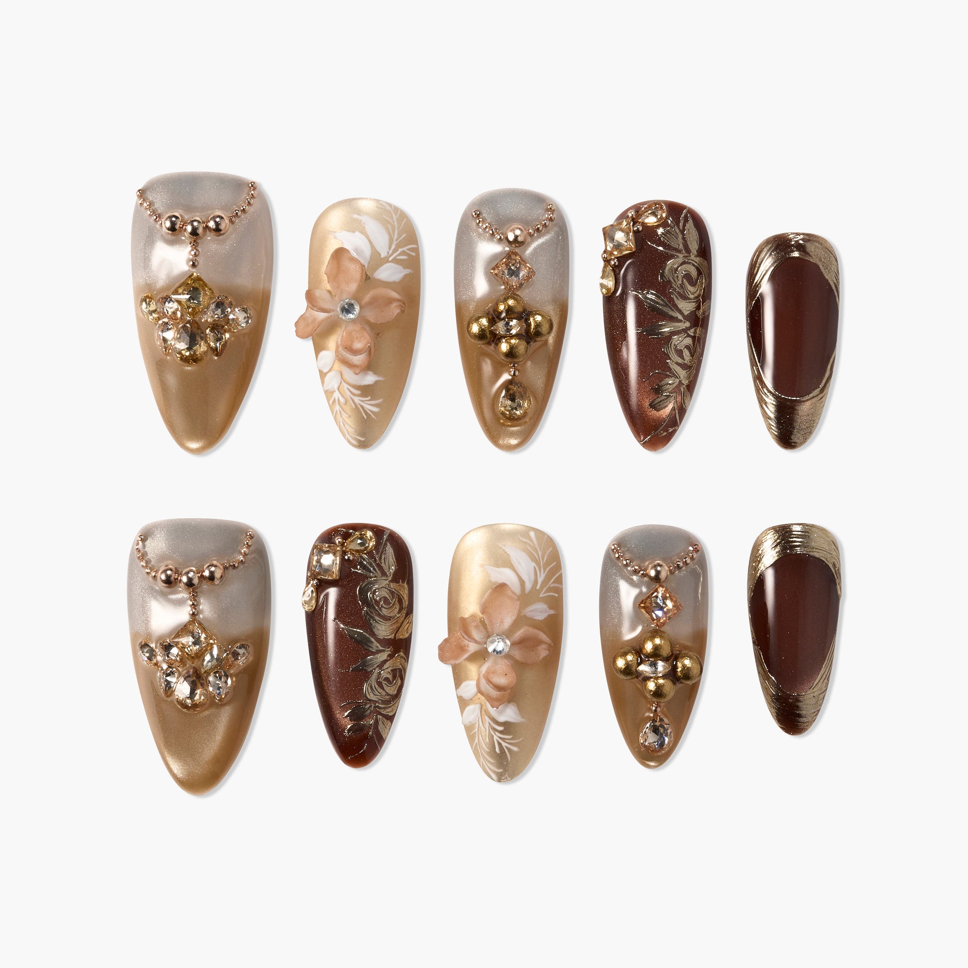 Handmade press-on nails set with gold, brown, and nude tones, featuring 3D florals and gems.