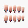 Set of nude press-on nails with burgundy tips and colorful rhinestone decorations