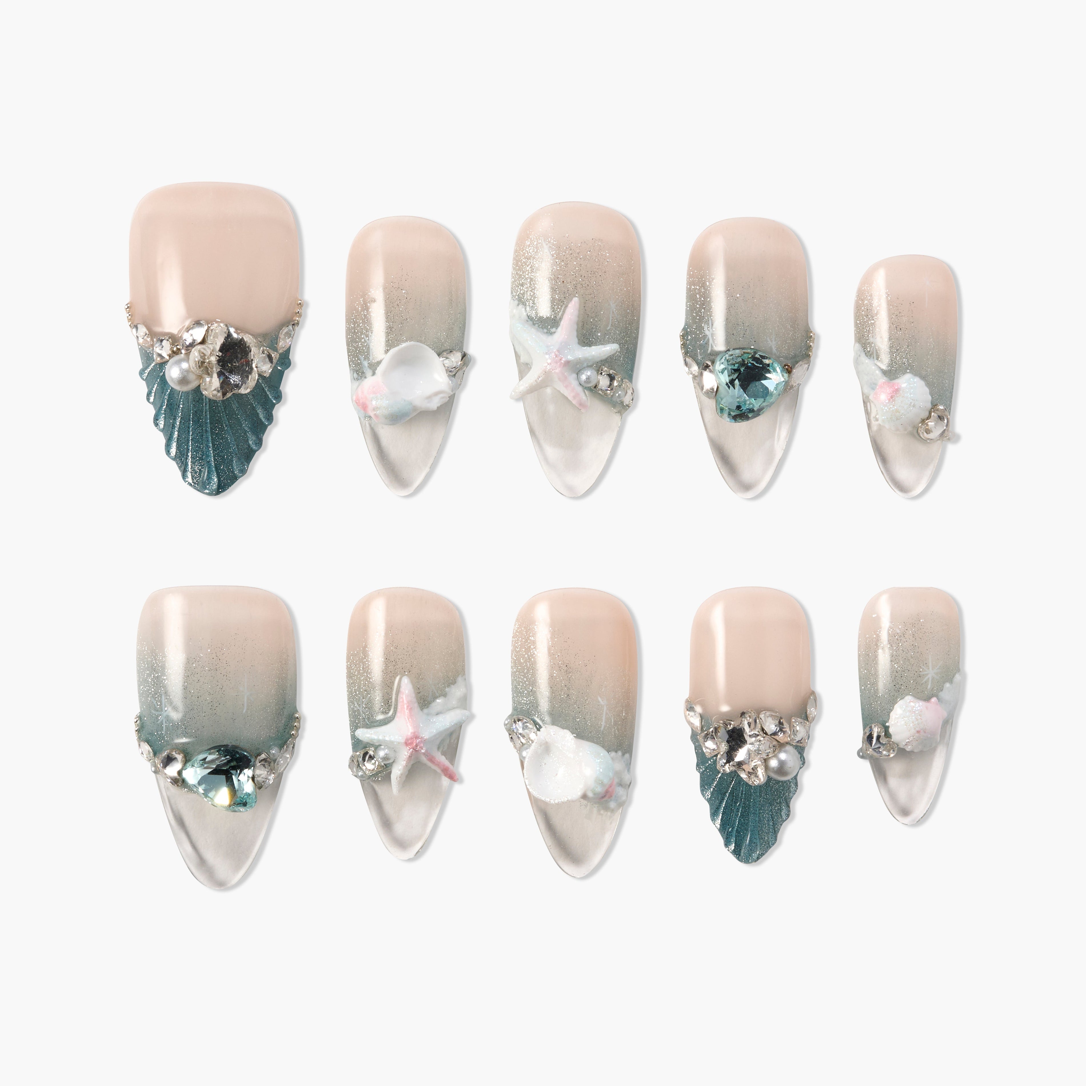 Set of glitter ombre press-on nails with seashell, starfish, and crystal embellishments