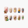 Set of pink shimmer press-on nails with 3D nature designs including flowers, carrot, caterpillar, butterfly, and ladybug