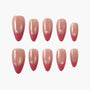 Set of 10 pink and nude gradient press on nails with glossy finish, arranged on white background