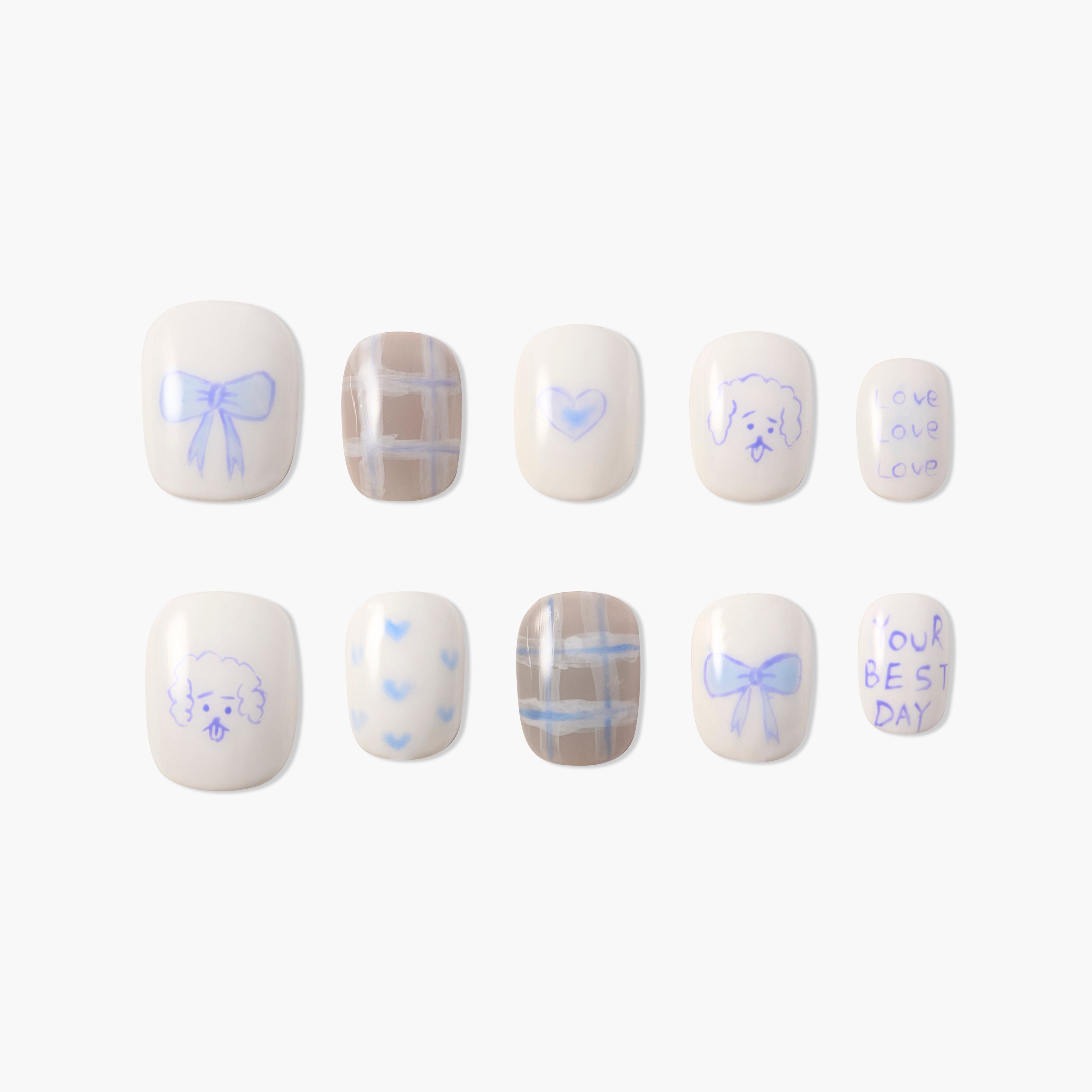 Set of 10 white press-on nails with blue designs including bows, hearts, dog faces, plaid, and handwritten words