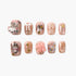 Set of pink glossy press-on nails with 3D cat designs, bows, pearls, and gold star accents