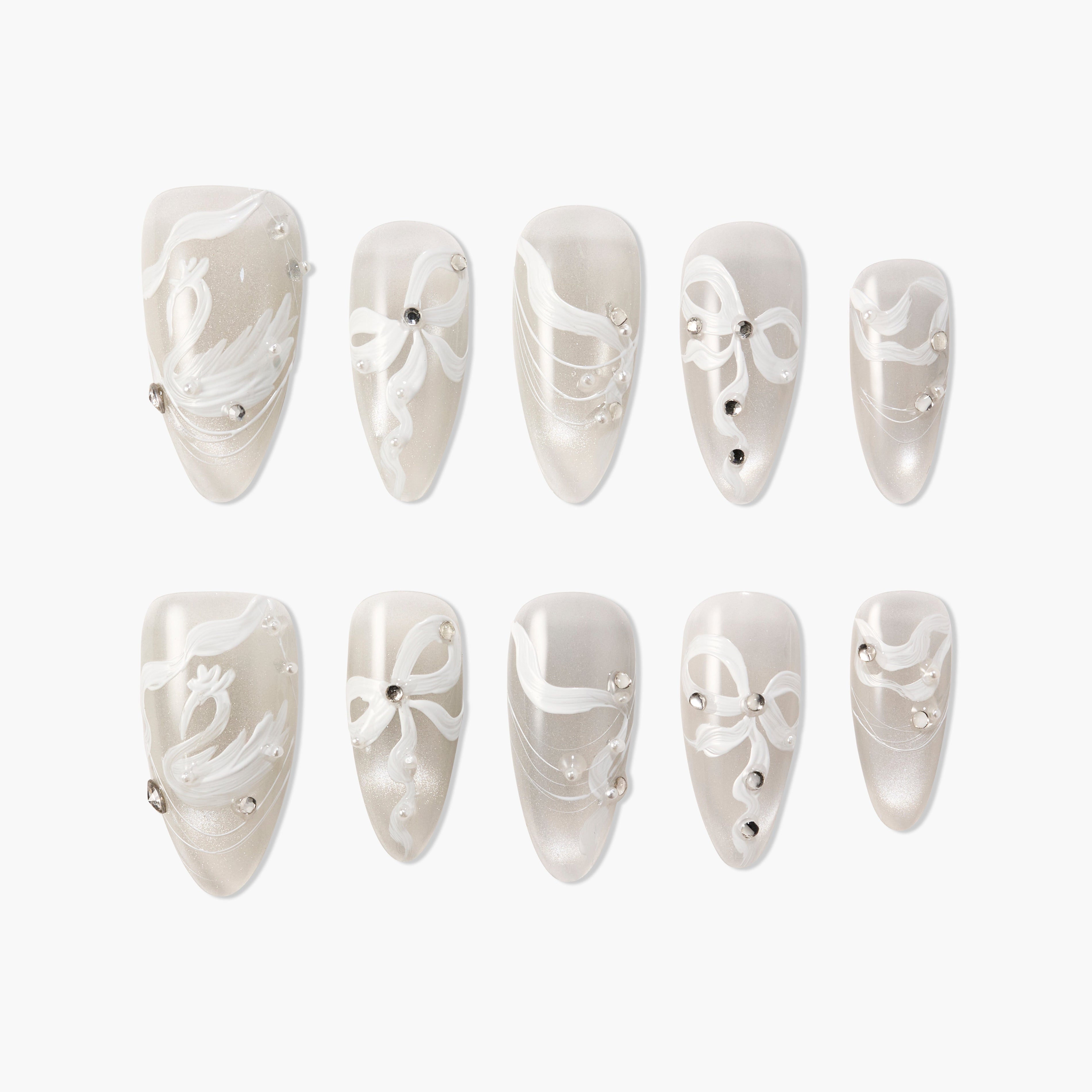 Elegant silver press-on nails with white ribbon and swan designs, adorned with rhinestones and pearls