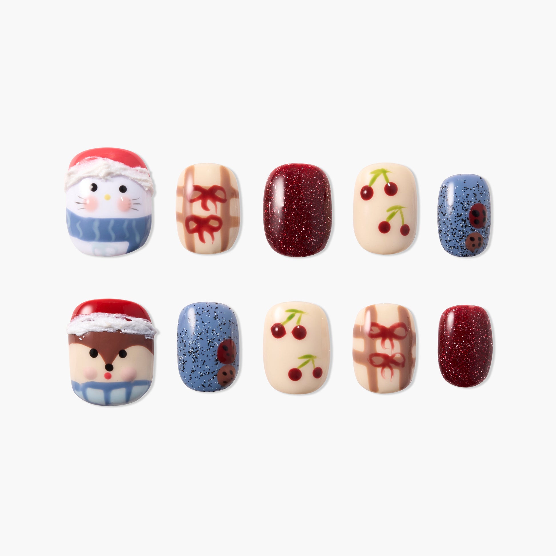 Set of 10 festive press-on nails featuring holiday characters, cherries, bows, glitter, and ladybugs