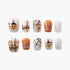 Halloween-themed press on nails with pumpkin, spider web, candy, and Halloween text designs