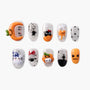 Halloween themed press-on nails with pumpkin, cat, spider, ghost, haunted house, and polka dot designs