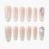 Set of nude pink press-on nails with glossy finish and crystal embellishments on two nails