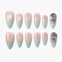 Set of 12 ombre press-on nails with pink to light blue gradient and rhinestone accents