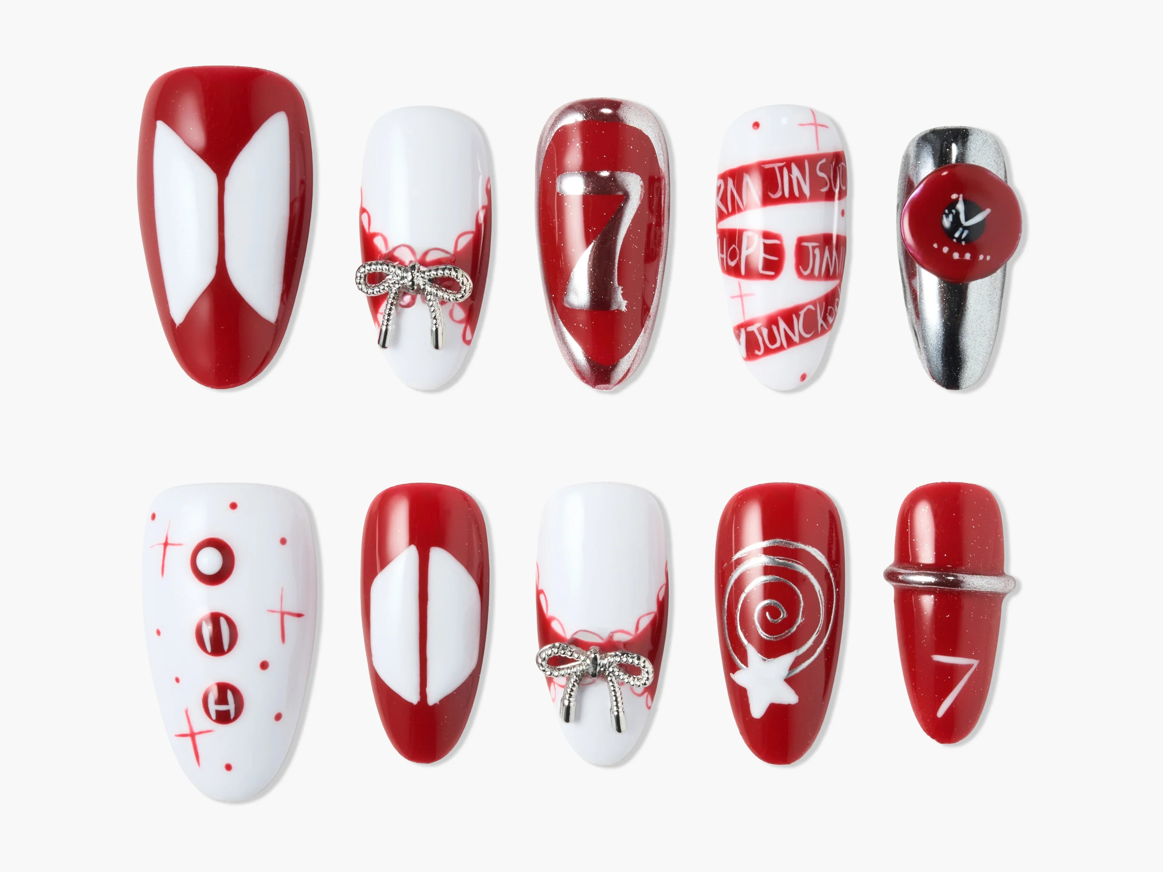 Handmade press-on nails set with red, white, and silver designs, bows, and number 7 accents.