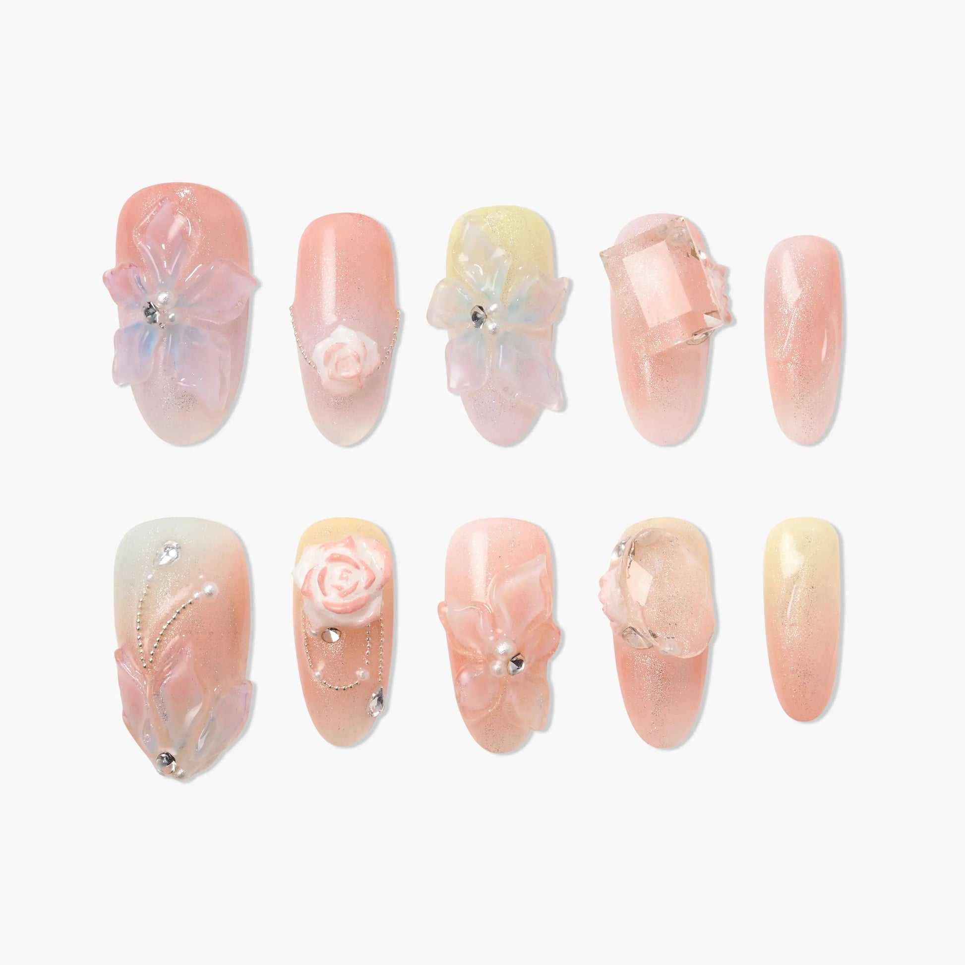 Handmade pink and nude press-on nails with 3D floral and gemstone designs