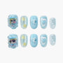 Blue press-on nails with cartoon designs, stars, hearts, and glitter accents
