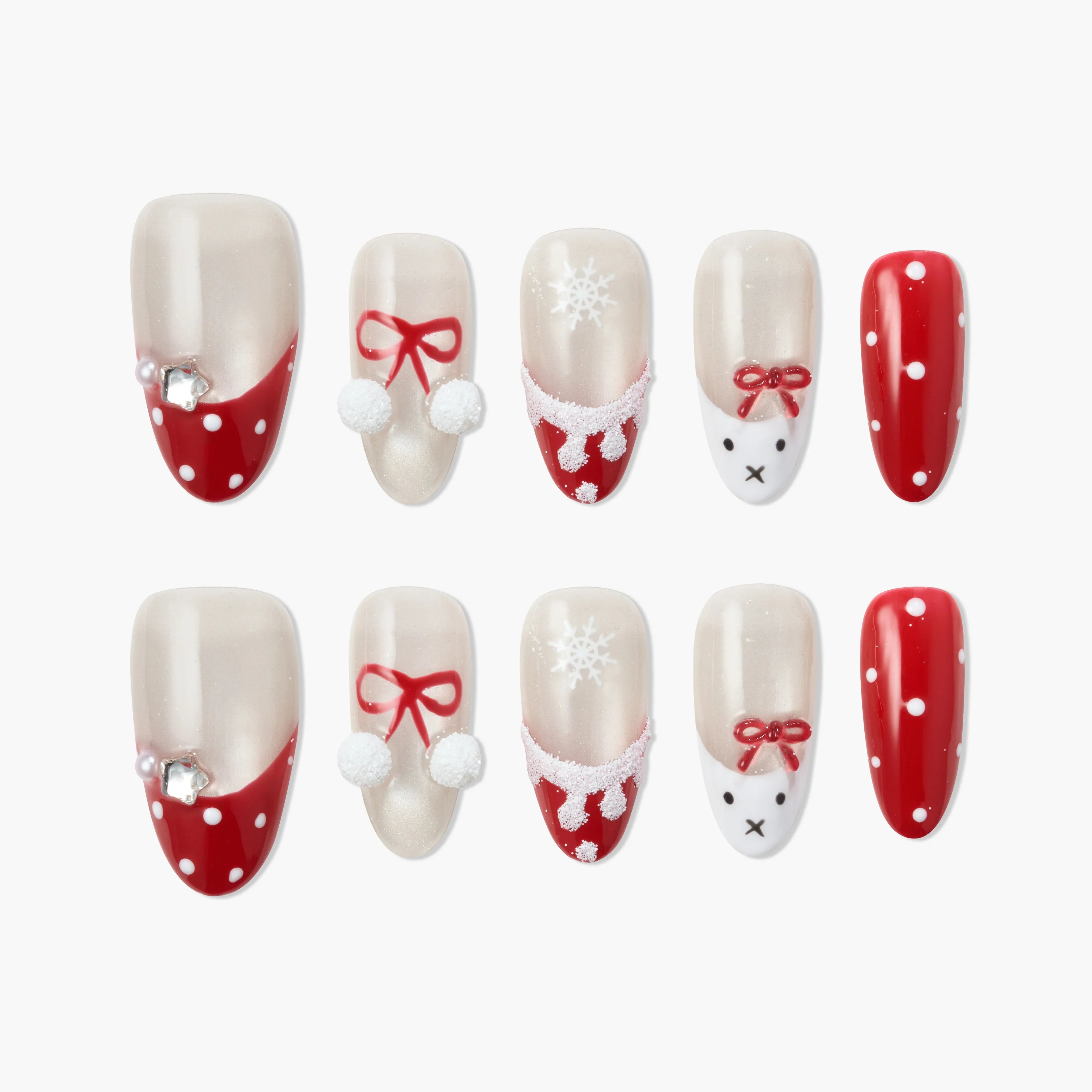 Handmade red and white festive press-on nails with snowflake, polka dot, and bow designs