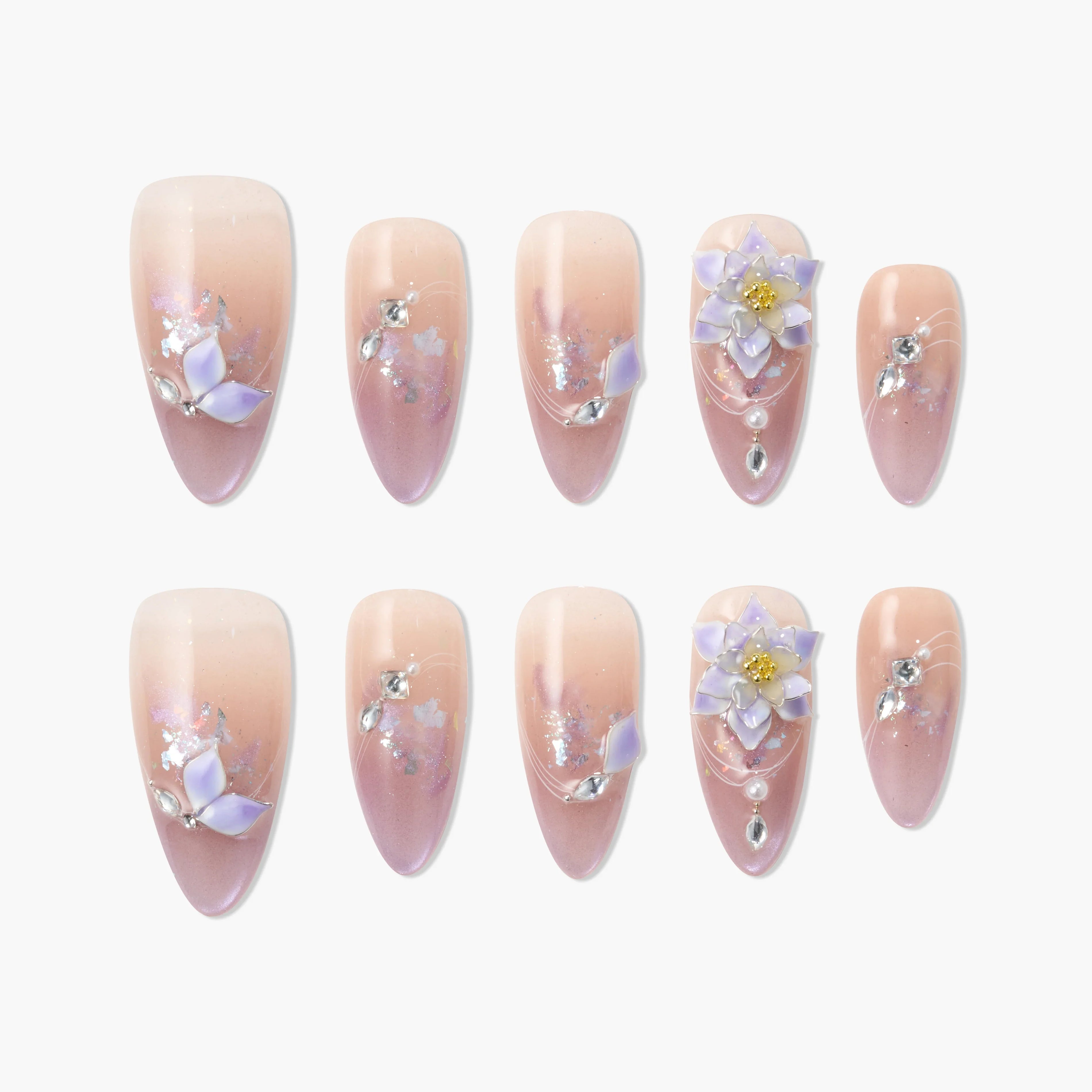 Handmade press-on nails with pink ombre, 3D purple floral accents, rhinestones, and glitter.