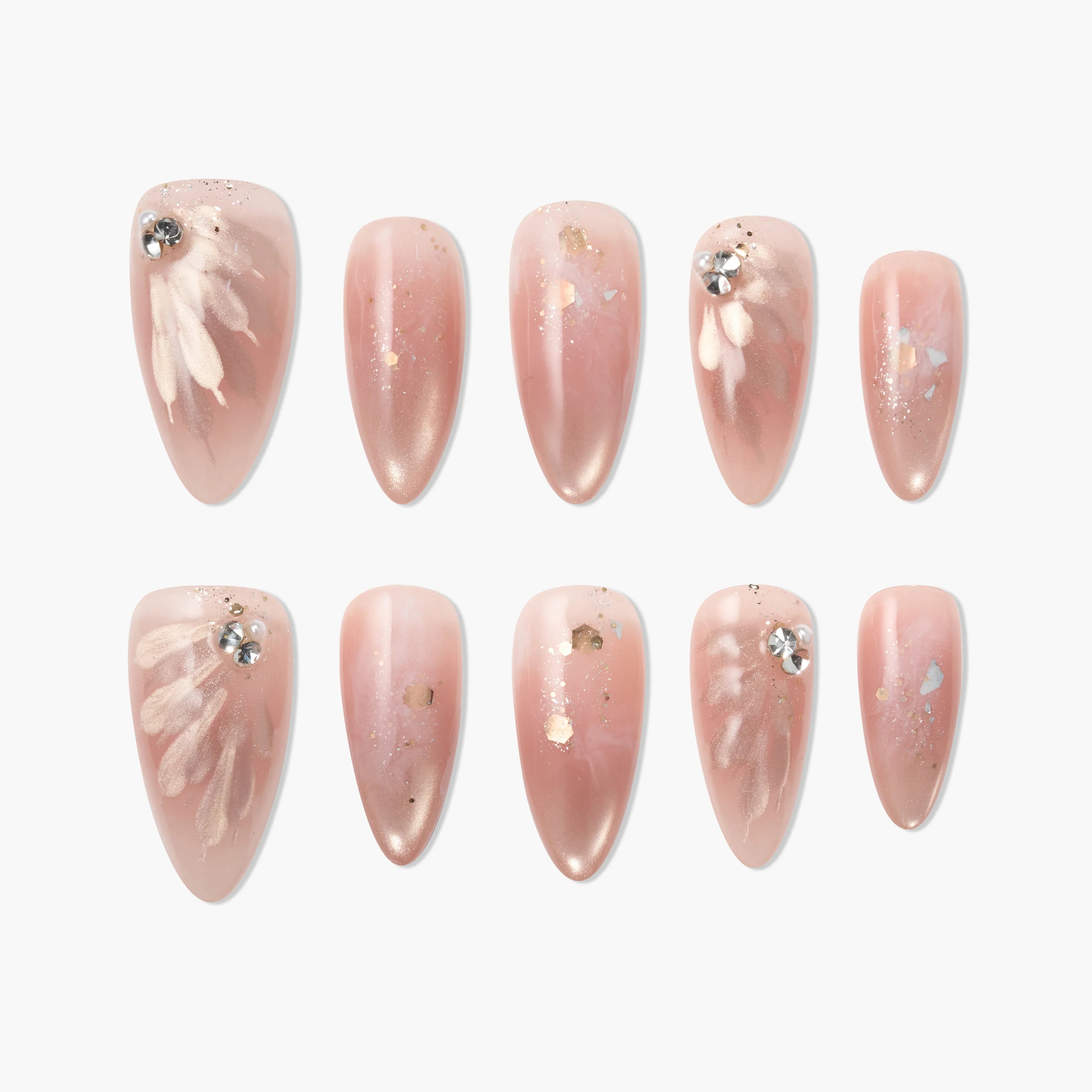 Handmade pink press-on nails with floral details, rhinestones, and subtle gold accents.