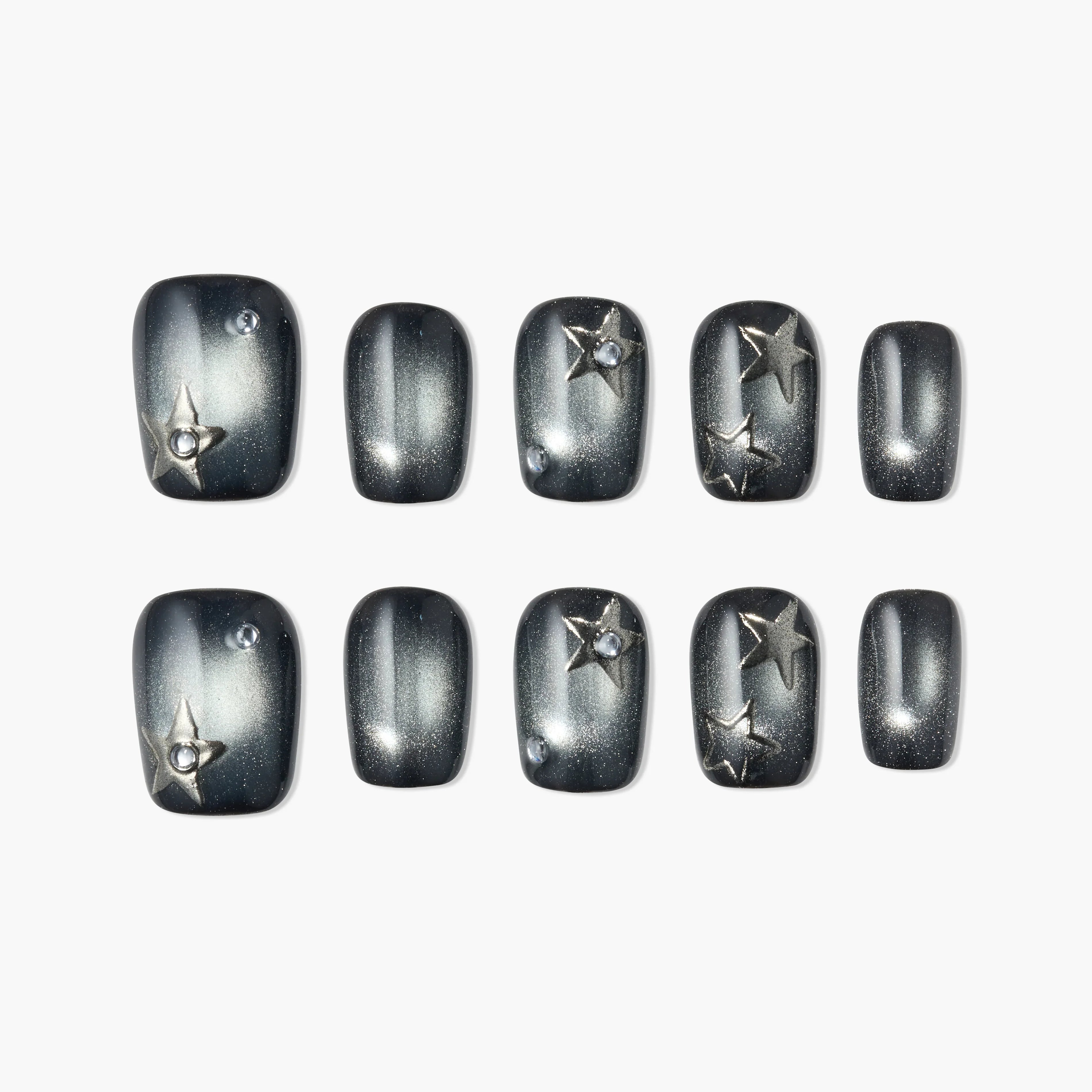 Black and silver press-on nails with 3D star accents and rhinestone details, set of ten.