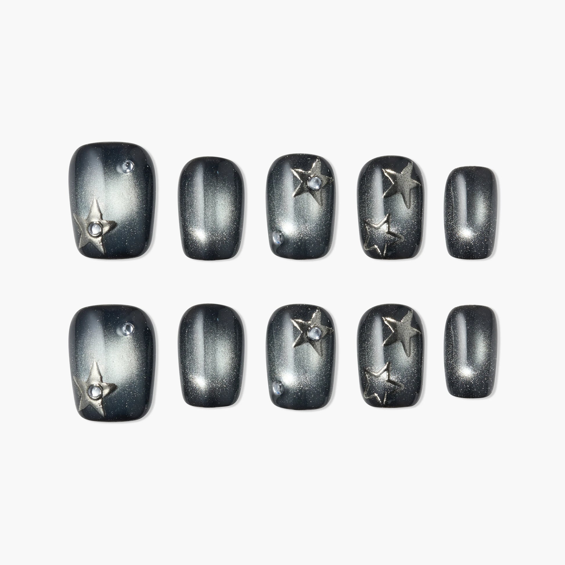 Black and silver press-on nails with 3D star accents and rhinestone details, set of ten.