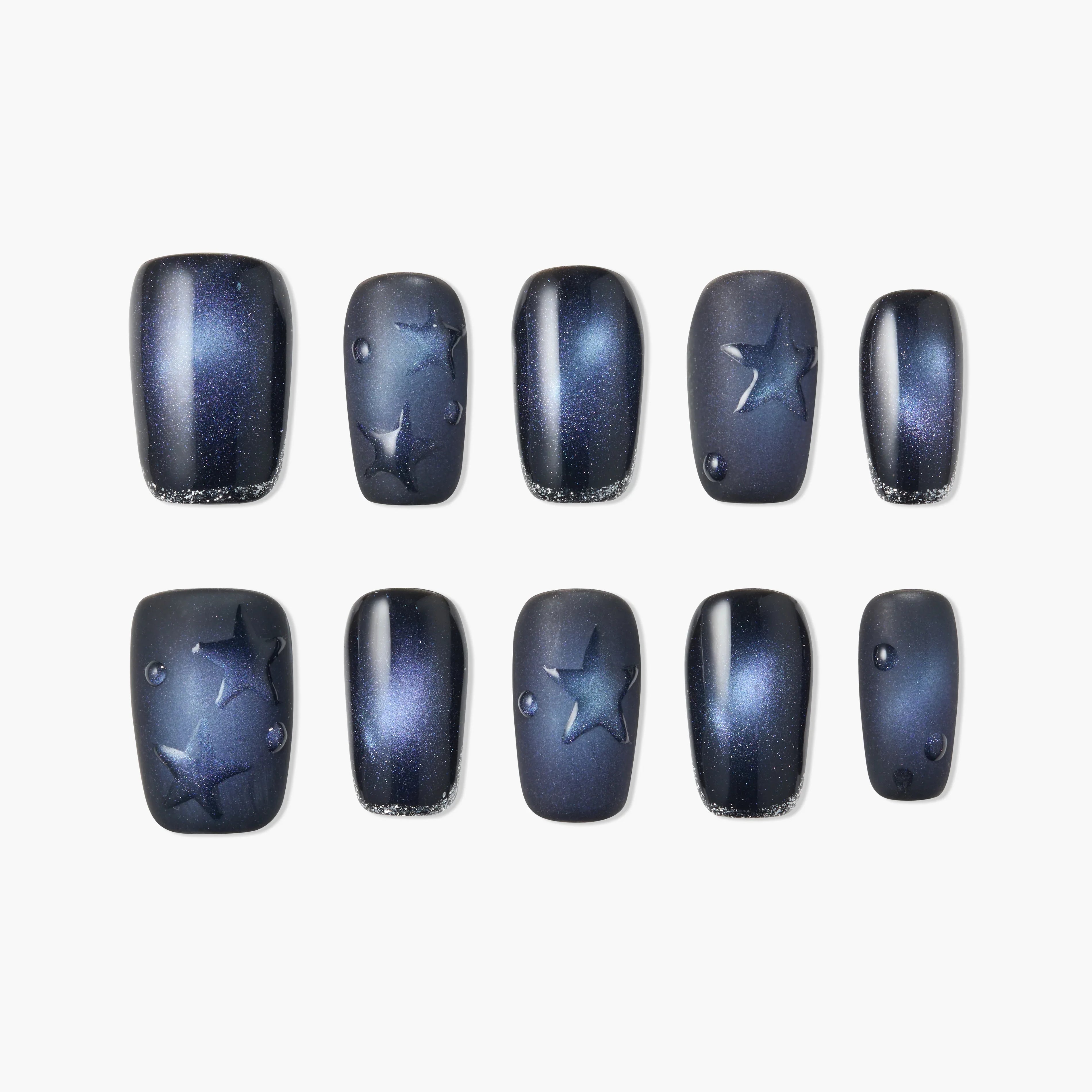 Handmade press-on nails with dark blue galaxy design, star accents, and glossy finish