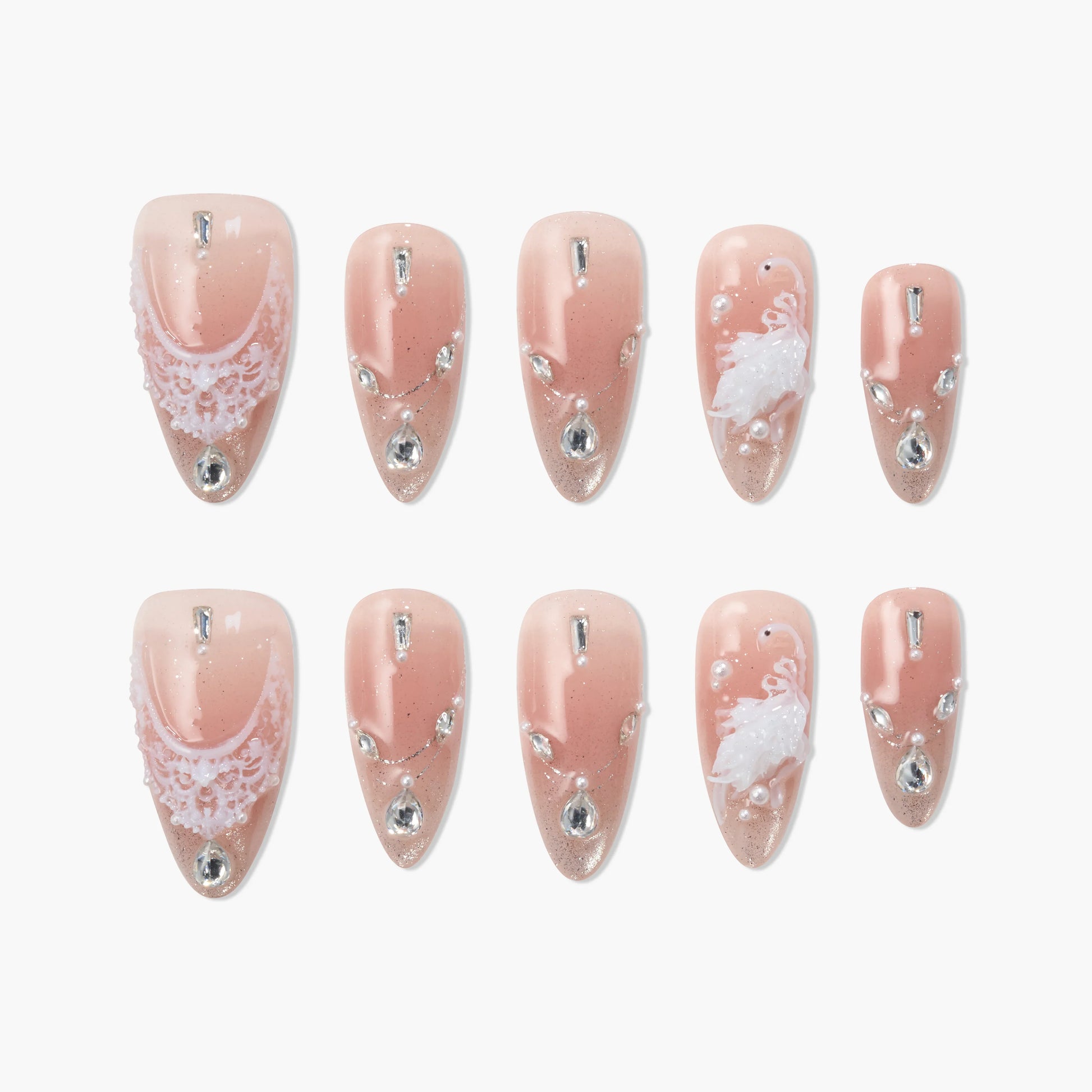 Handmade press-on nails in blush pink with lace, rhinestones, pearls, and 3D floral accents