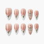 Handmade press-on nails in pink and white French tip design with jeweled accents