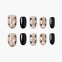 Handmade press-on nails set with pearl nude base, black floral accents, and solid black nails