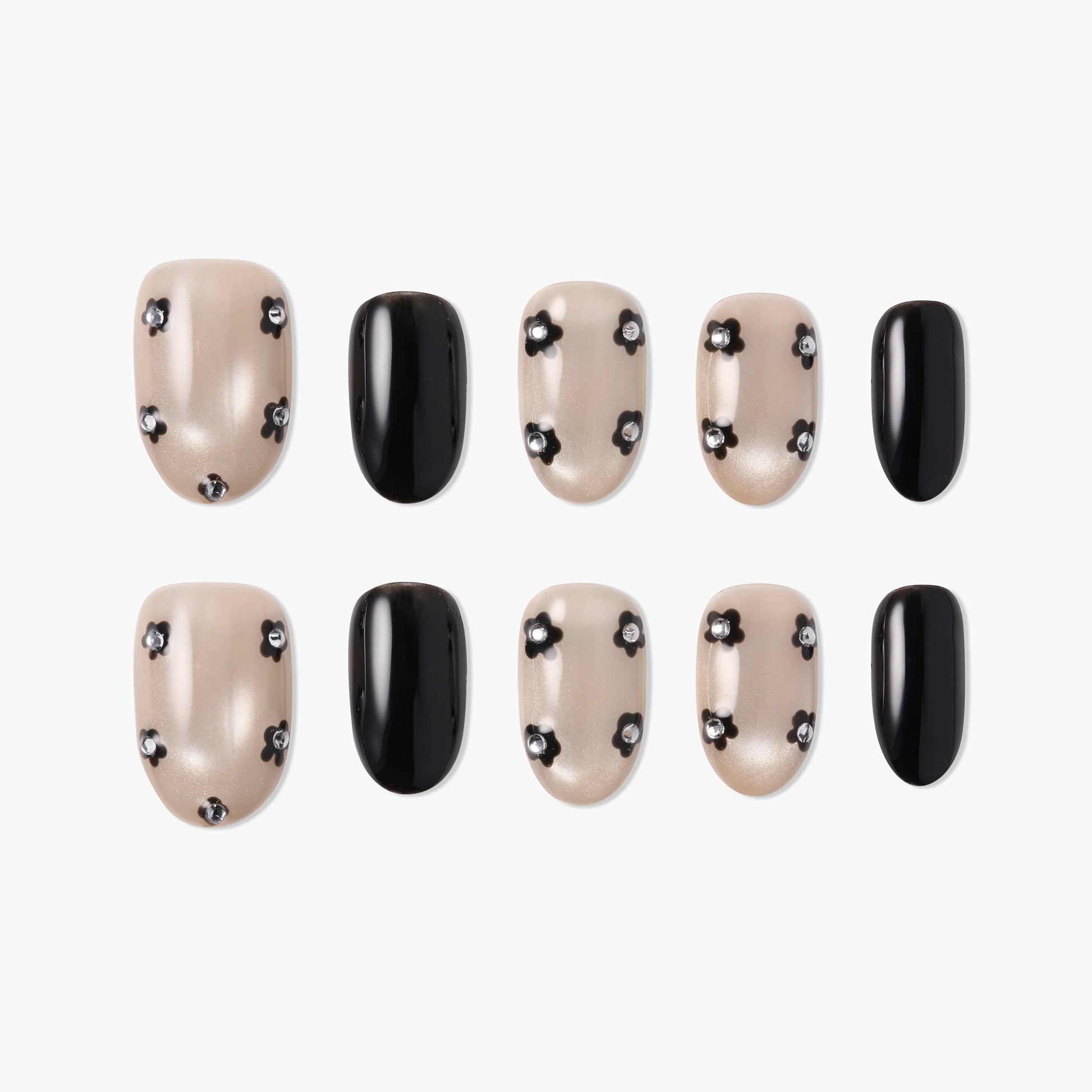 Handmade press-on nails set with pearl nude base, black floral accents, and solid black nails
