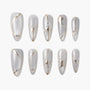 Set of gray press-on nails with gold lines and small silver rhinestone accents.