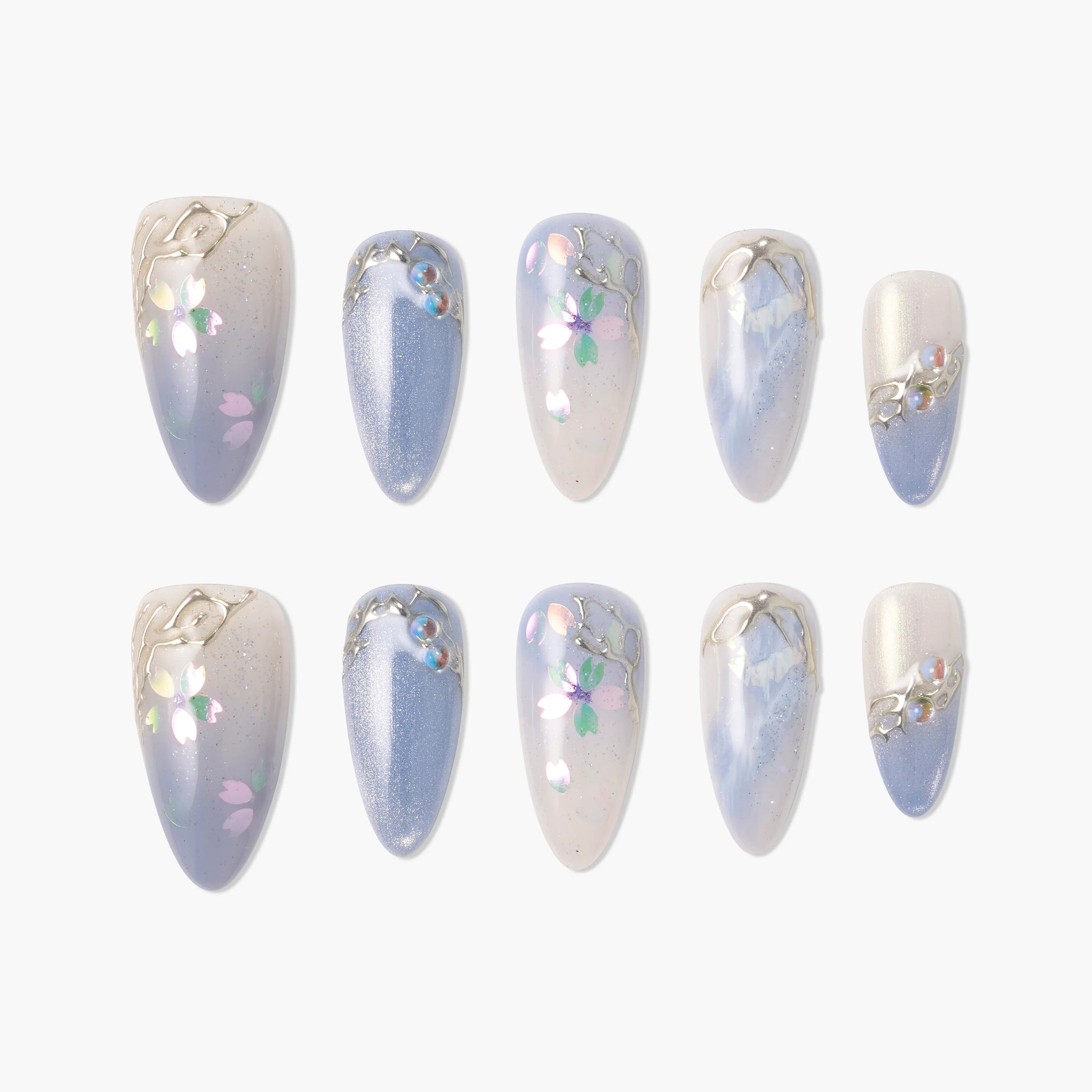 Handmade press-on nails with pastel blue, floral accents, pearl embellishments, and metallic details