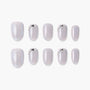 Handmade iridescent press-on nails set with pearl and metallic accents, neutral gray tones