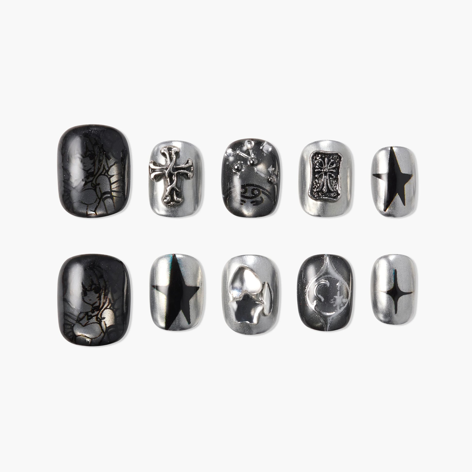 Metallic silver and black press-on nails with gothic and celestial designs, including stars and crosses.