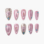 Pink press-on nails set with gemstone accents, rhinestones, and intricate metallic details
