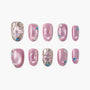 Set of pink press-on nails with silver accents, gemstones, and intricate 3D nail art designs.