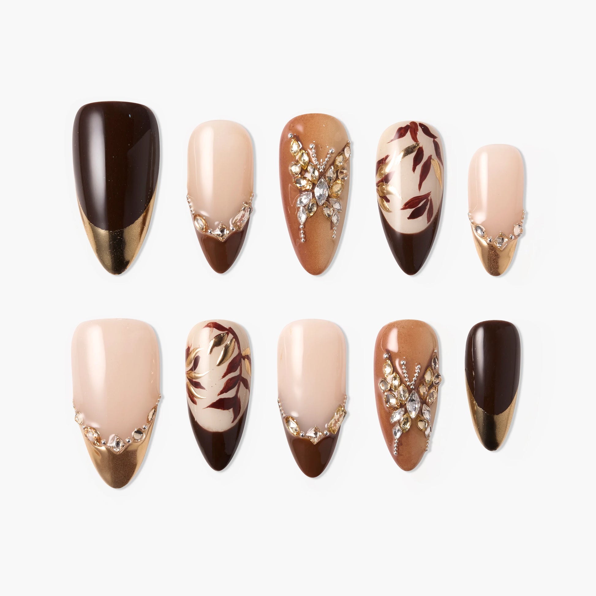 Handmade brown and gold press-on nails with leaf designs and crystal accents, glossy finish