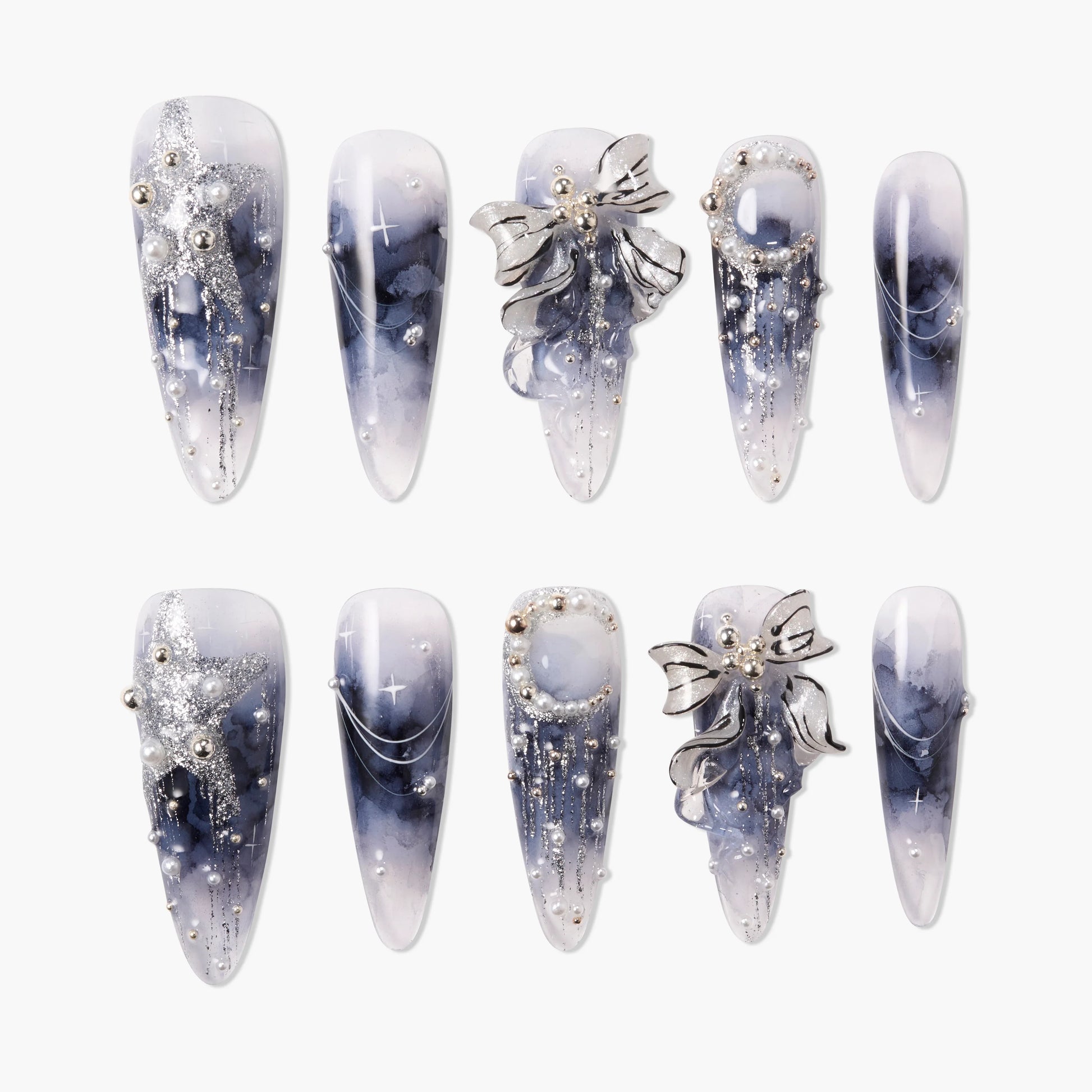 Handmade press-on nails with blue marble design, silver bows, pearls, and glitter accents
