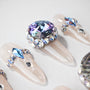 Handmade press-on nails with clear base and large blue rhinestone and crystal embellishments